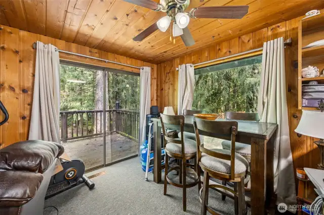 Dining area has a ceiling fan, and plenty of room for a good sized table.