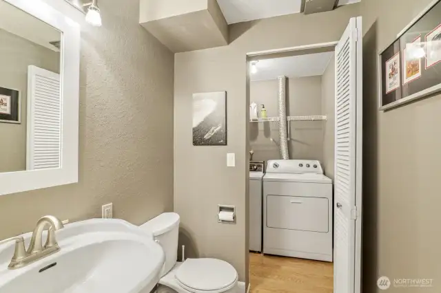 Downstairs half bath and laundry area.