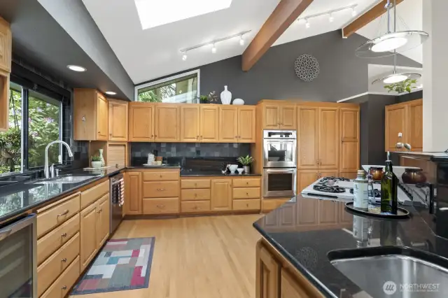 LOTS of cupboard and counter space. Don't miss the double oven, skylights and beverage refrigerator.