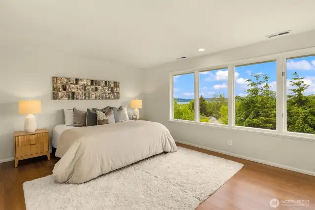 Primary suite with commanding Lake Washington and Cascade Mountain views.