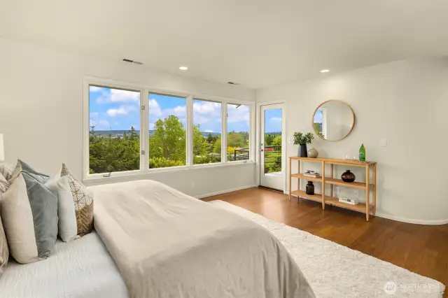 Primary suite has a deck and dual walk-in closets.