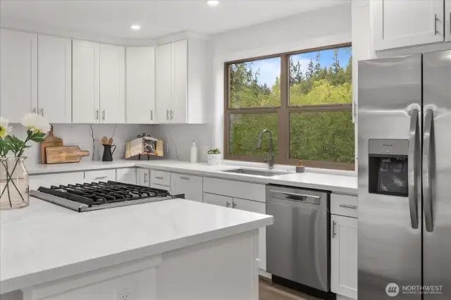 Brand new Kitchen Aide dual fuel range, as well as new fridge/freezer and dishwasher.