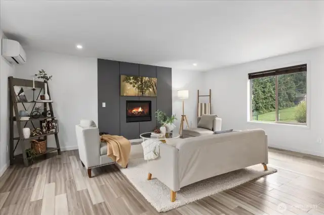 A gas fireplace brightens and warms the room on chilly Pacific Northwest nights.