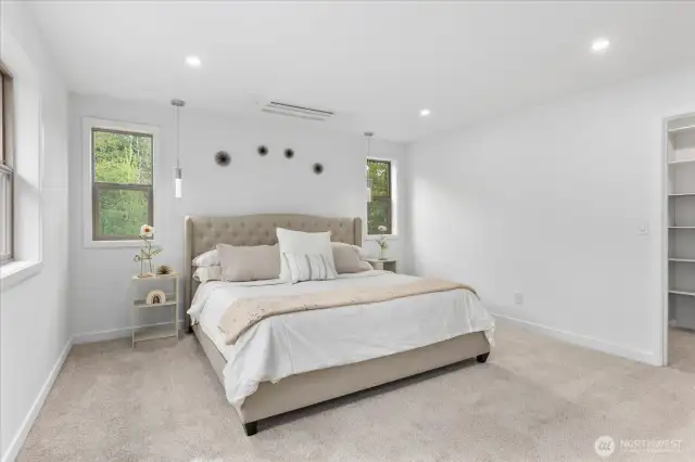 The primary suite is spacious and inviting.