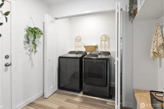 The laundry area with generous storage and folding area.