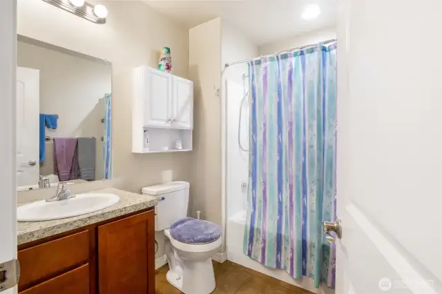 Main bathroom with shower and tub.