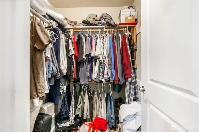 Primary bedroom walk-in closet.