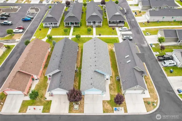 You'll enjoy the quiet neighborhood where this home is located. Just a couple homes over to the left is more visitor parking, just a short walk down the sidewalk. POV: no street on the porch side of the home!