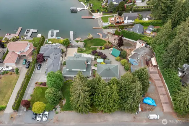 Combined .61 acre lot offers 3408 square foot updated home with 3 large bedrooms with walk in closets, an additional 3 bedrooms with walk in closets, formal living and dining, open family room and kitchen, huge rec room with wetbar.  Perfect set up for entertaining lots of people