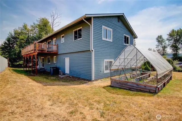 Northwest corner of home has nice green house.
