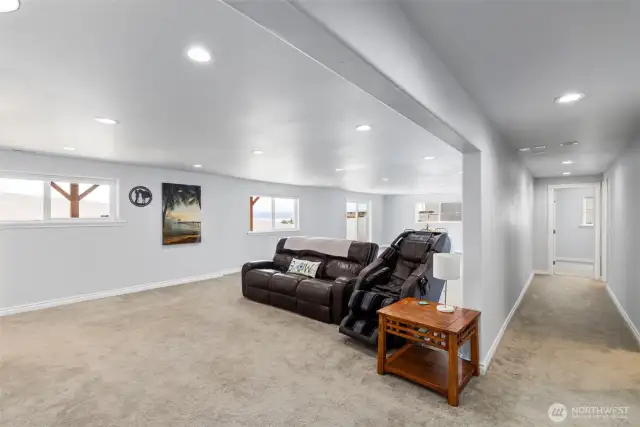 Downstairs living room and wetbar area with 3 extra rooms.