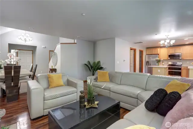 The living room is cozy yet open, ideal for relaxing or entertaining guests.