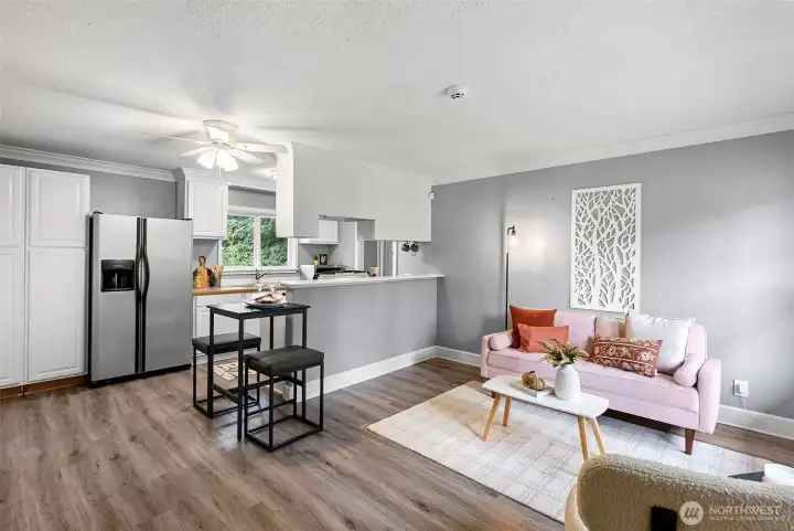 Open floor plan with lots of natural light coming through the windows.