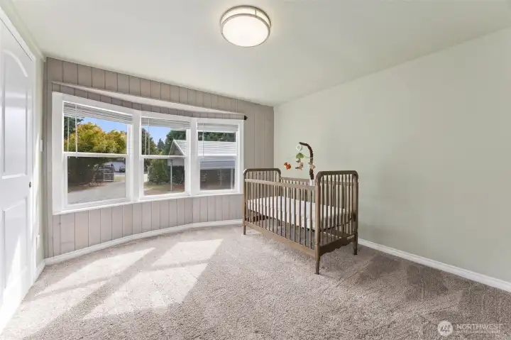 Bedroom with newer carpet.