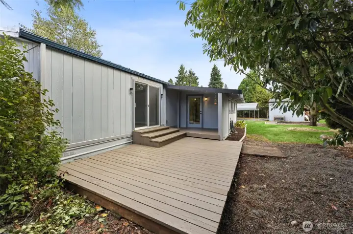 Adjacent large deck with back door and master bedroom access.