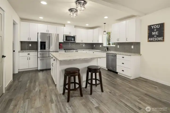 Beautiful open concept kitchen with tons of cabinets and countertop space plus large island