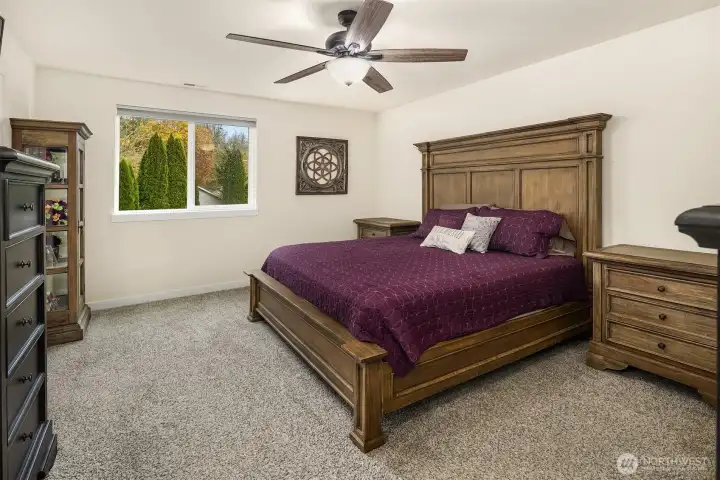 Primary bedroom with east facing windows & mountain views.