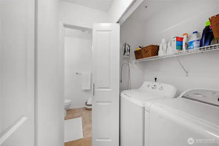 Hallway laundry area, appliance remain with home