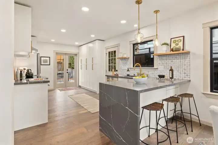 Very spacious kitchen with tons of cabinets.  French Doors leading out to the backyard.