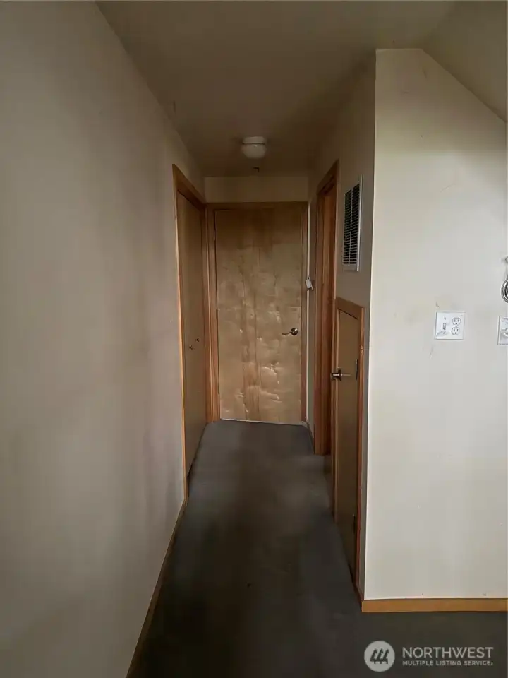 Hallway to bedroom, full bathroom & utility room