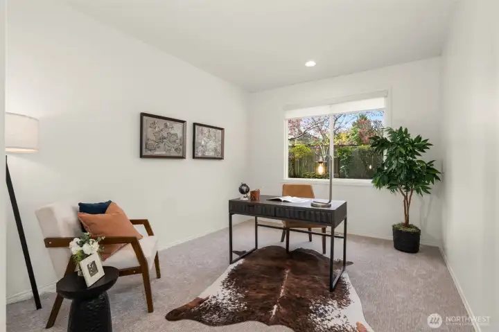 Office/den on the main level with adjacent half bathroom.