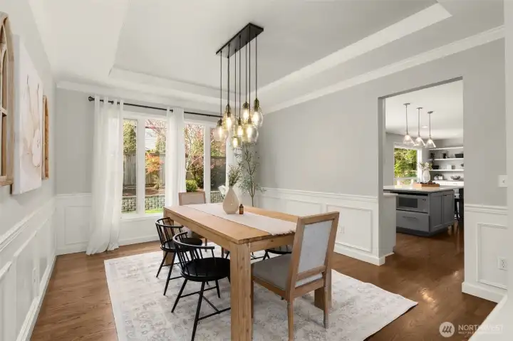 Tray-ceiling over the dining room conveniently positioned adjacent to the kitchen.