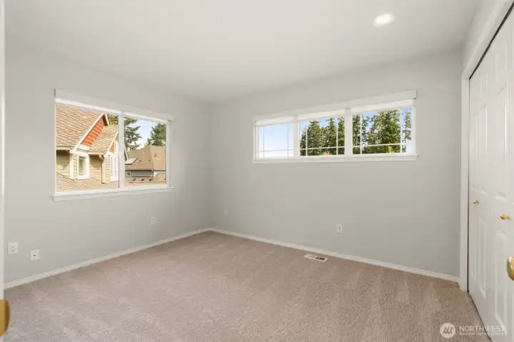 Third upper level bedroom. Don't miss the mountain views.