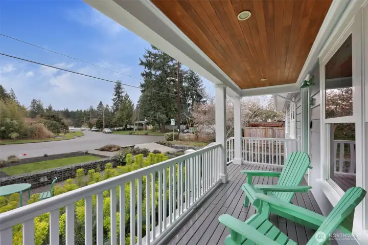 The charming front porch was added for leisurely mornings with coffee, overlooking the incredibly landscaped front yard and beautiful spring blooms.