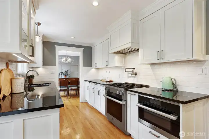 Thoughtful details make this kitchen a delight. Have the house to yourself? Dinner for 1 or 2 is easy in the Bosch convection microwave oven at right!