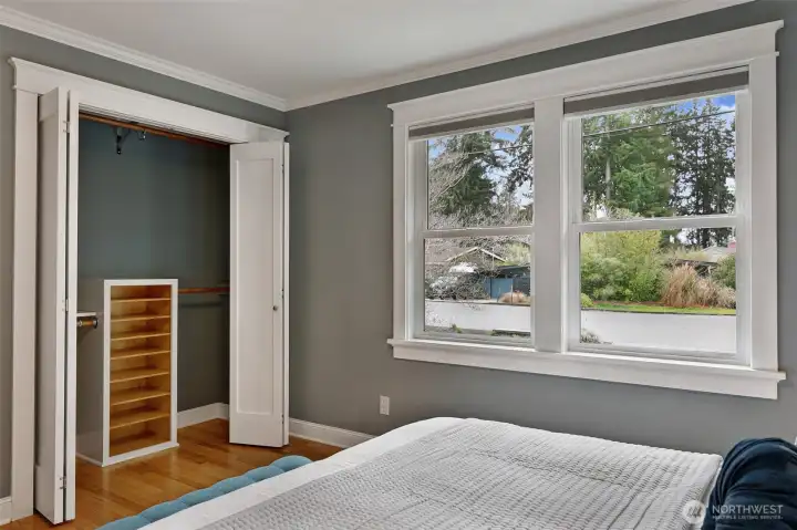 The primary closet has dual hanging rods and custom built-ins, so everything has its place.