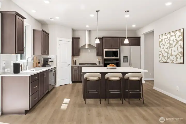 Gourmet kitchen. Photo's are for representational purposes only. Colors and finishes may differ.