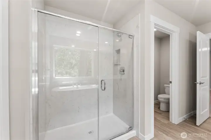 Marble surround in shower. Photo's are for representational purposes only. Colors and finishes may differ.