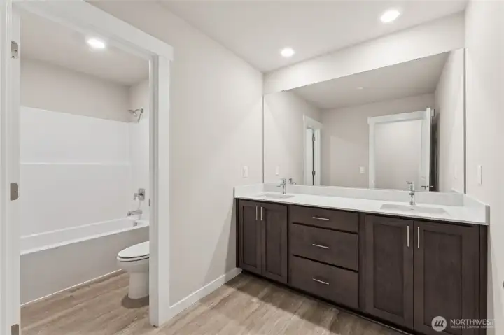 Double vanity and separation in main bath for multiple users. Photo's are for representational purposes only. Colors and finishes may differ.