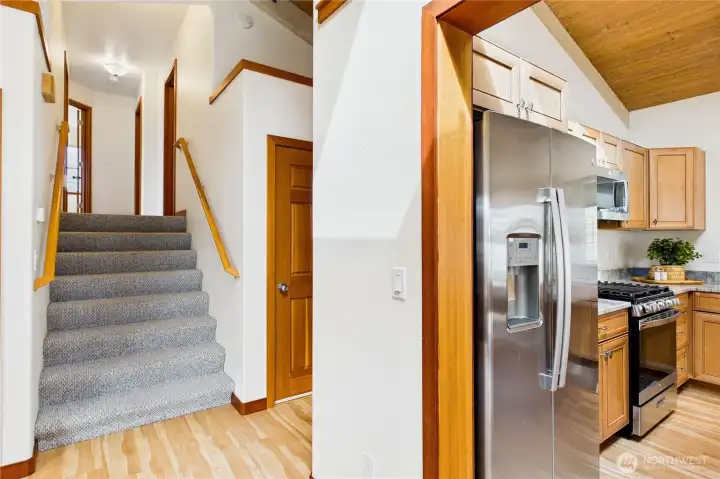 Stairs to bedrooms and laundry and half bath to the right