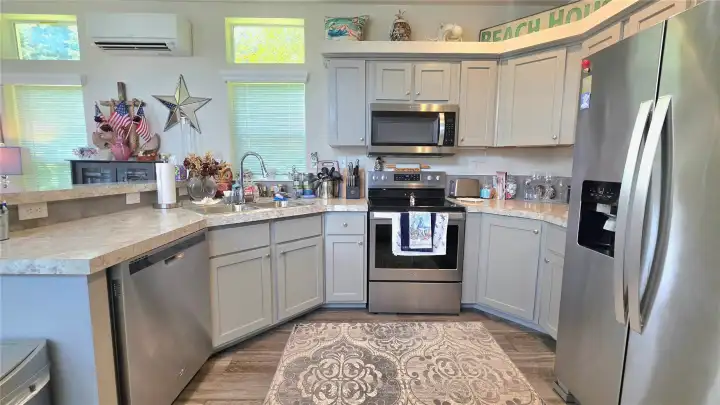 Plenty of counter space and cupboards.  A newly installed mini split unit keeps the home very efficient and cozy.