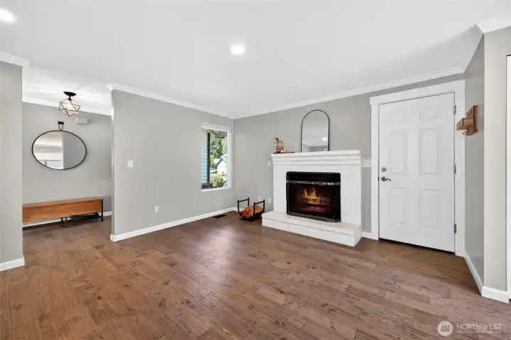 Wood burning fireplace off kitchen