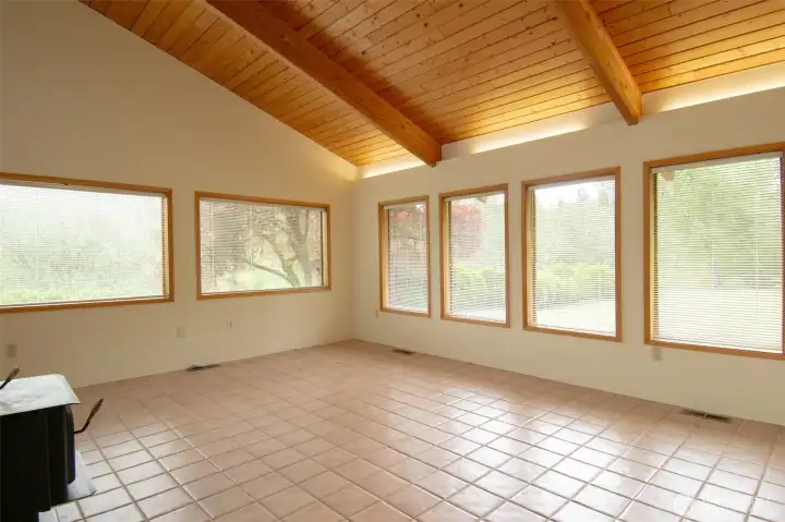 Wood Cathedral ceiling in great room with recessed lighting