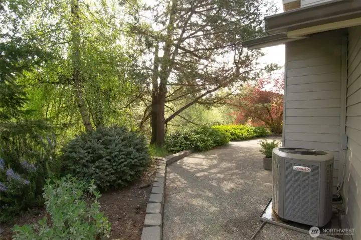 Heat Pump provides efficient heating and cooling. Home exterior is Clear Cedar Beveled Siding.