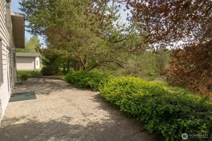 Agregate patio surrounds the home