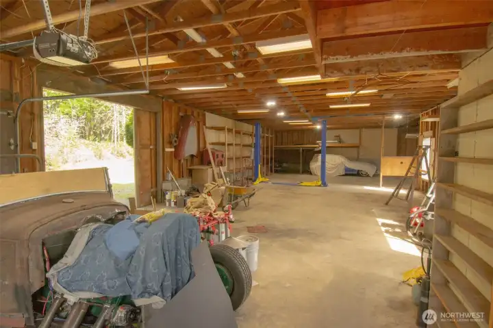 Shop features 10 foot ceilings, plumbing and water heater.