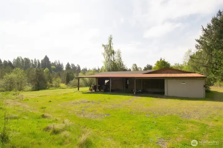 View of open bay lean-to that is 20 ft deep, located on the right of the back of shop.