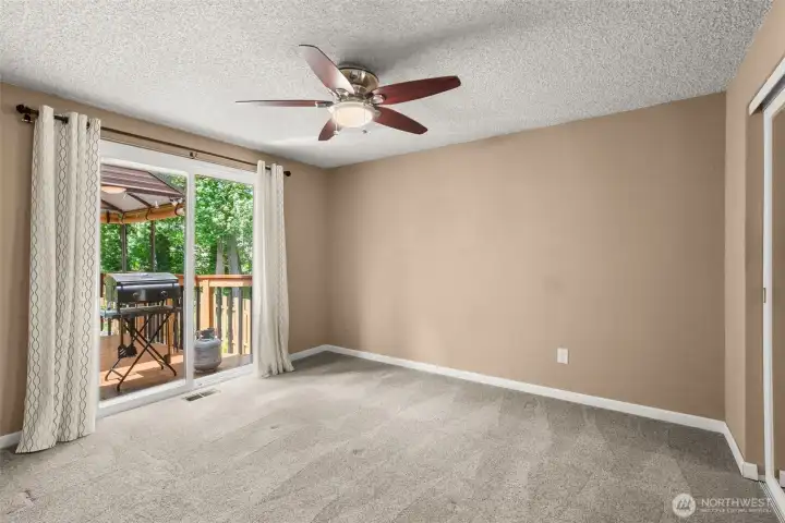 Primary bedroom with glass slider to the covered deck