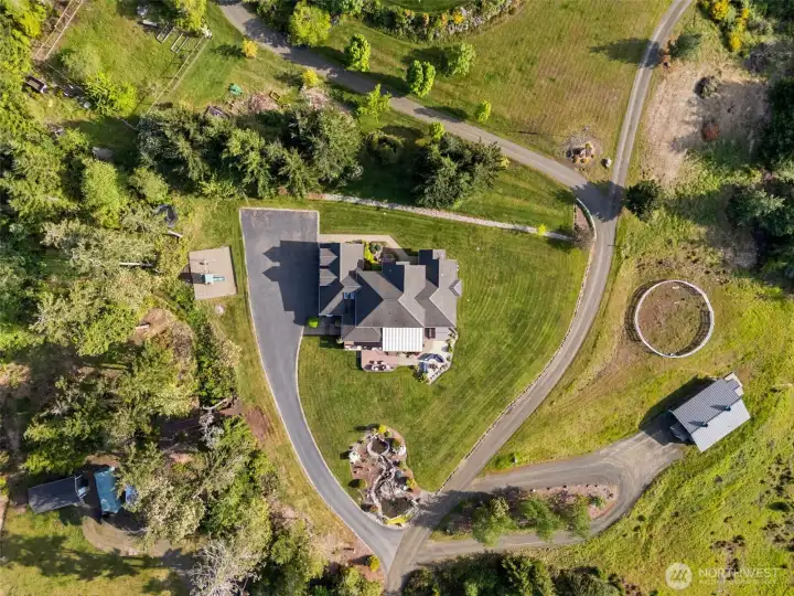The estate to include the outdoor arena, detached office, shop, and house.