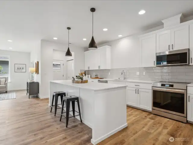 Convenient eating island in the Kitchen.  (Photo is from Lot 2 - a mirror floorplan of this home)