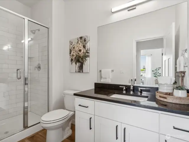 Downstairs Bathroom.  (Photo is from Lot 2 - a mirror floorplan of this home)