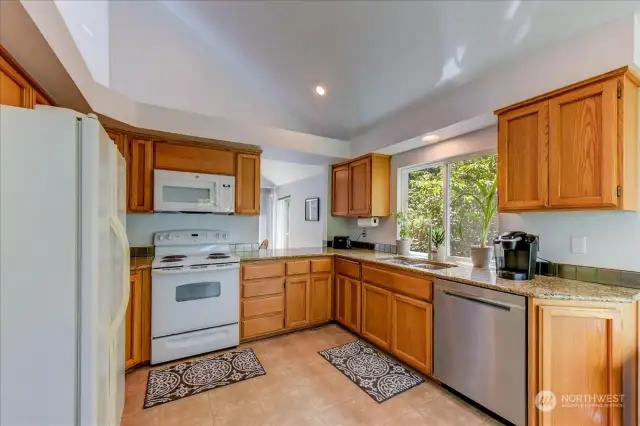 Large kitchen with updated counter-tops & pass thru window