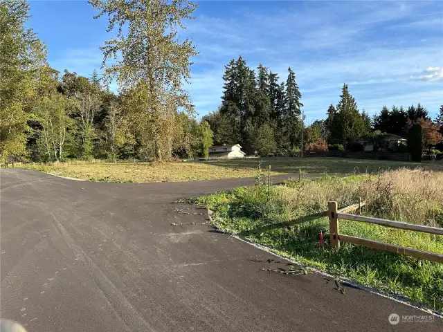 Shared access. Driveway for lot goes to the right.