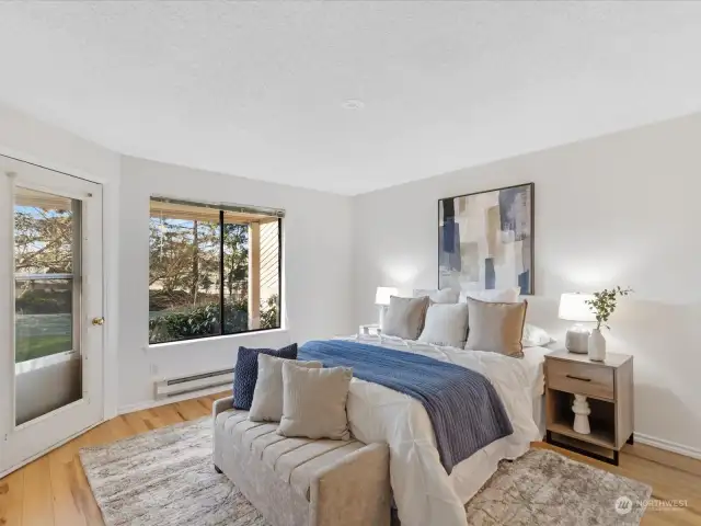 The spacious primary bedroom includes a door to the covered patio.