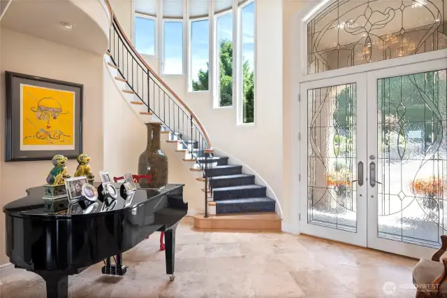 Soaring ceilings and elegant winding staircase