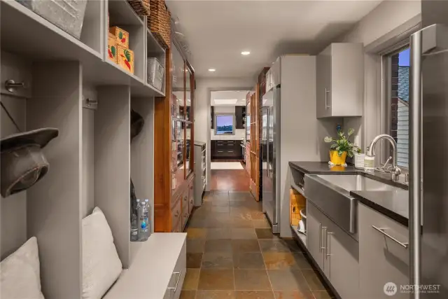 2nd Refrigerator, sink & storage off kitchen which extends into a mud room with exterior access.